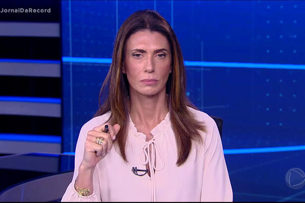 Janine Borba apresentando o Jornal da Record desta quinta-feira, 10 de junho.