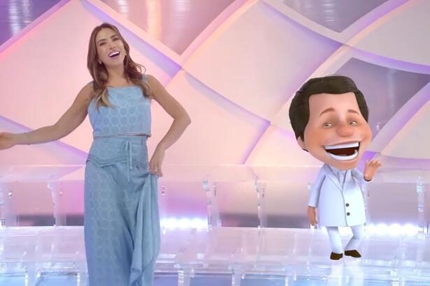 Patricia Abravanel ao lado do boneco de animação do Silvio Santos, nos estúdios do Programa Silvio Santos, em trecho da vinheta de final de ano do SBT