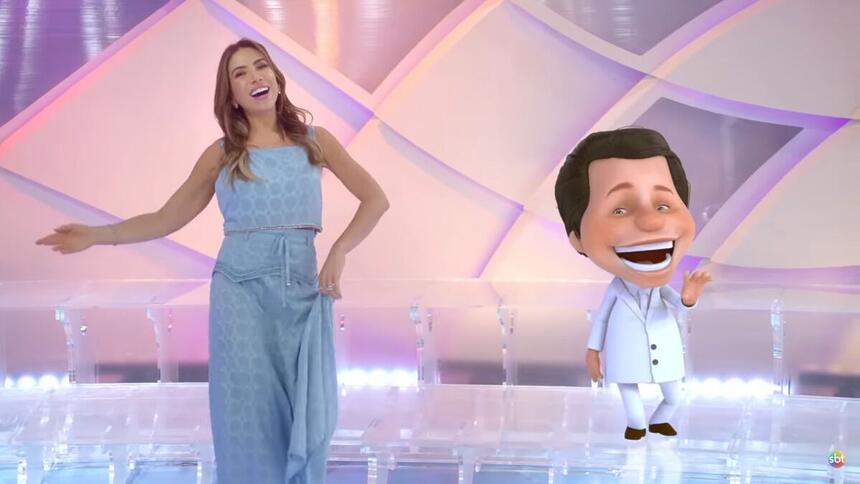 Patricia Abravanel ao lado do boneco de animação do Silvio Santos, nos estúdios do Programa Silvio Santos, em trecho da vinheta de final de ano do SBT