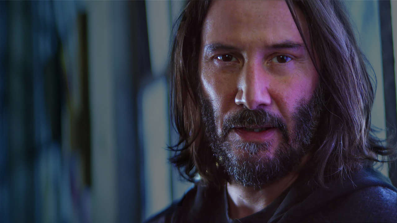 Keanu Reeves posa para foto em set de filme