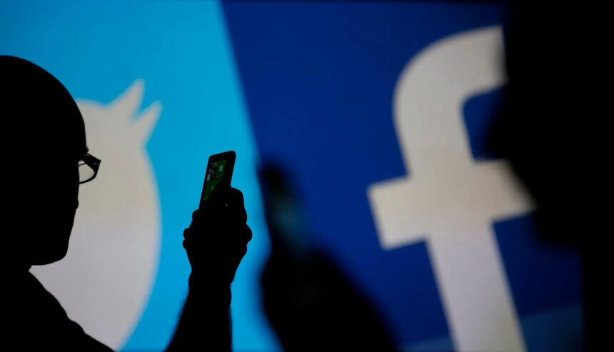 Logos de Twitter e Facebook, com um celular na frente