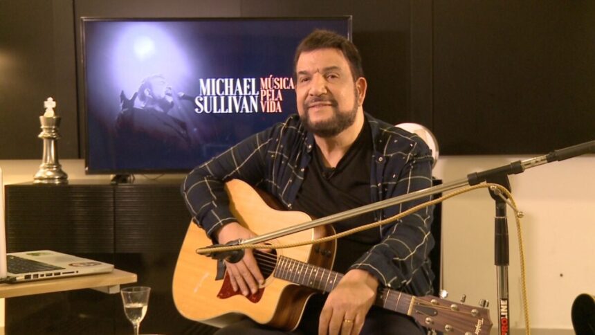 Michael Sullivan com o violão nas mãos