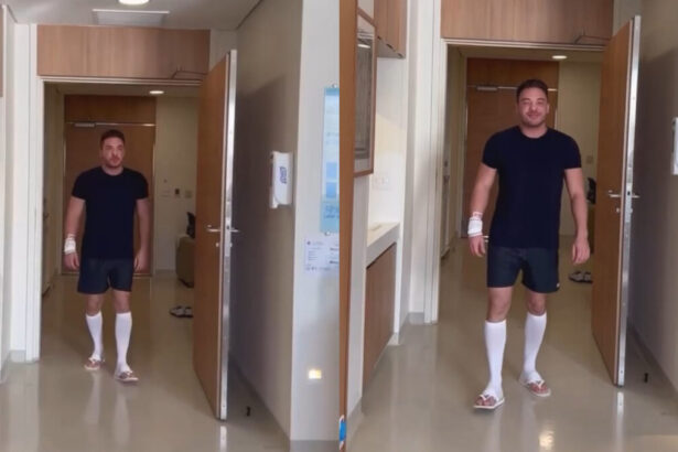 Wesley Safadão andando no corredor do hospital após cirurgia