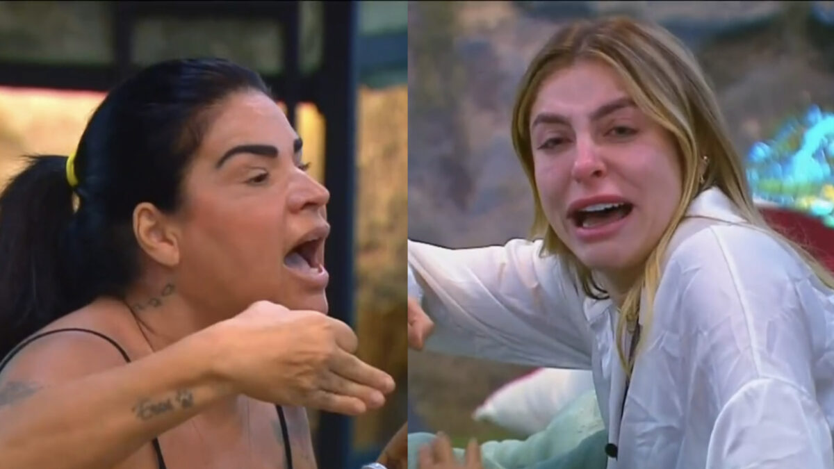 Solange com a mão levantada brigando com Victória Bellato que chora no ilha Record 2