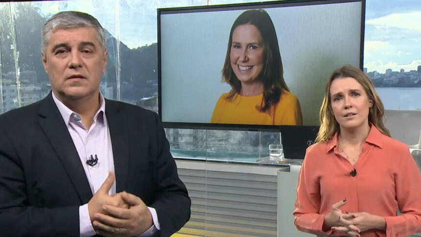 Flavio Fachel e Silvana Ramiro, no estúdio do Bom Dia RJ, com uma imagem de Susana Naspoli no televisor ao fundo