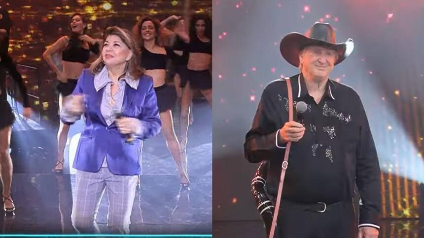 Roberta Miranda vestida com roupa azul, segurando o microfone no palco do Faustão Na Band. Sérgio Reais vestido de roupa preta e segurando um berrante.