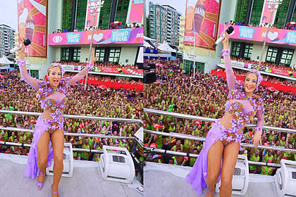 Claudia Leitte levanta os braços em cima do trio e mostra o público em seu último dia de carnaval em Salvador