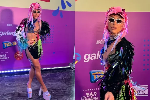 Sabrina Sato de vestido preto com adereços coloridos para desfile no bloco Unidos da Brahma