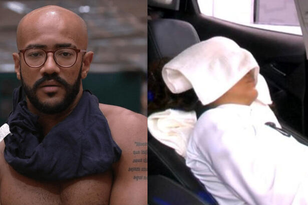 Ricardo, sem camisa, olhando para as imagens no telão, em montagem para Domitila, dormindo no carro do quarto branco, com uma toalha na cabeça