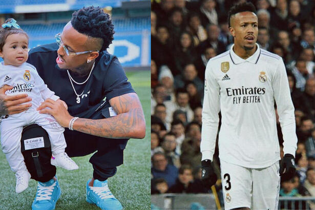 Éder Militão posando com a pequena Cecilia no colo, no gramado do estádio do Real Madrid