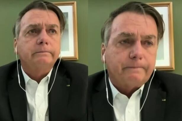 Bolsonaro de terno e camisa branca chorando ao vivo, em entrevista a Jovem Pan