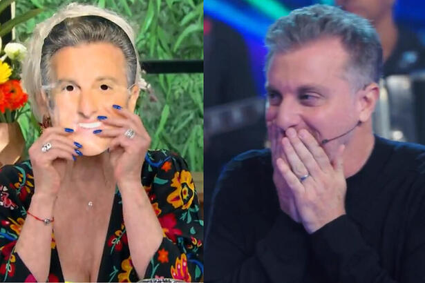 Ana Maria Braga com a máscara e Luciano Huck surpreso no Domingão