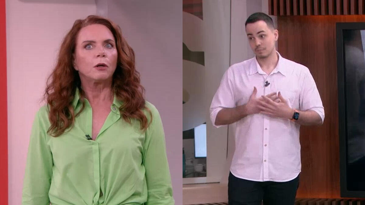 Leilane Neubarth olha assustada para o comentarista Thássius Veloso que passa mal no cenário da GloboNews