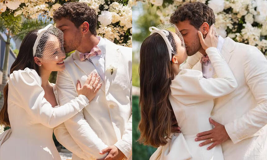 Larissa Manoela e André Luiz Frambach de branco, se beijando durante casametno