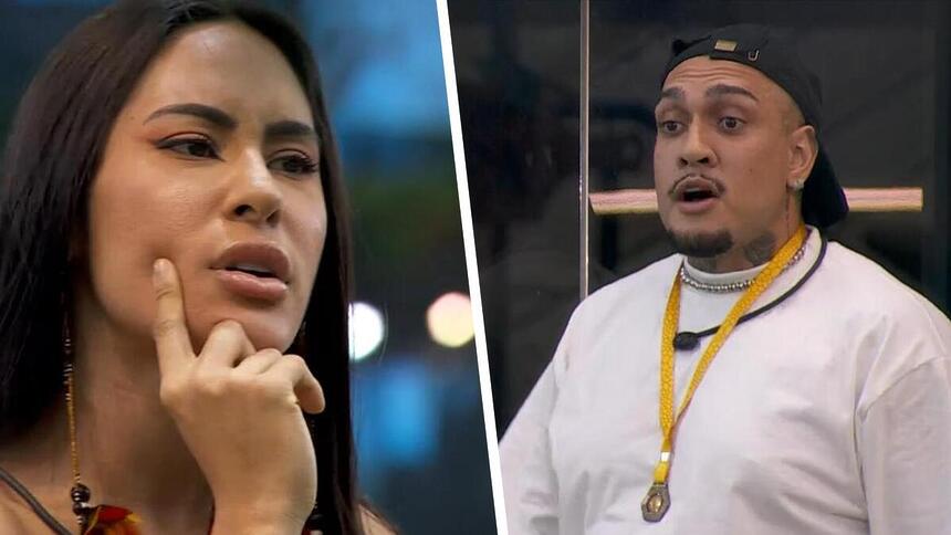 Isabelle com a mão no queixo discutindo com Mc Bin Laden que aparece com a boca aberta na porta da cozinha do BBB 24