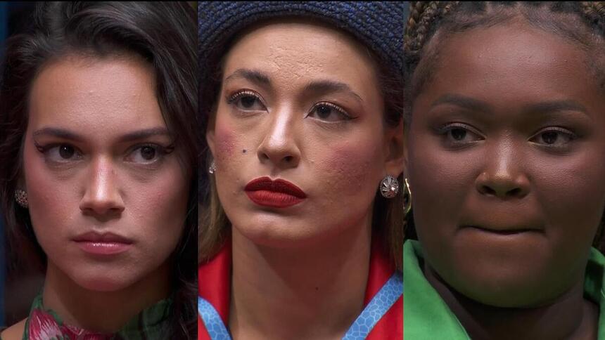 Alane, Beatriz e Raquele com semblantes sérios, sentadas no sofá do BBB 24 na formação do Paredão