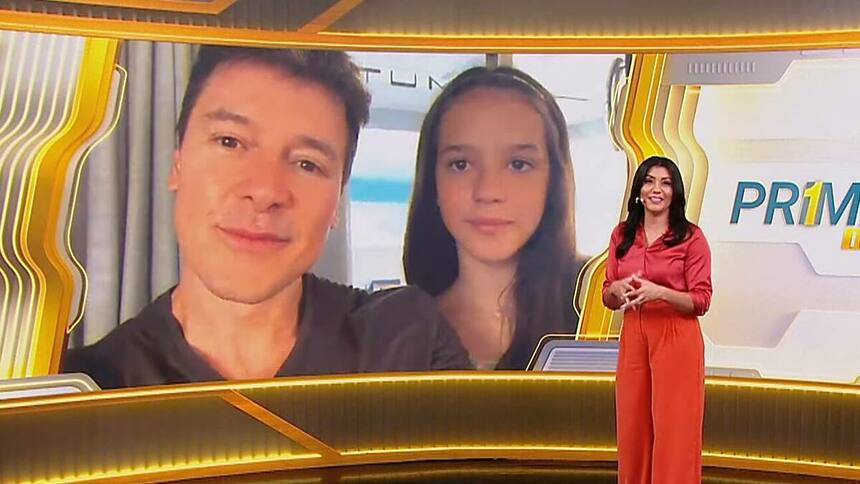 Rodrigo Faro e a Filha participando pro chamada de vídeo do Primeiro Impacto