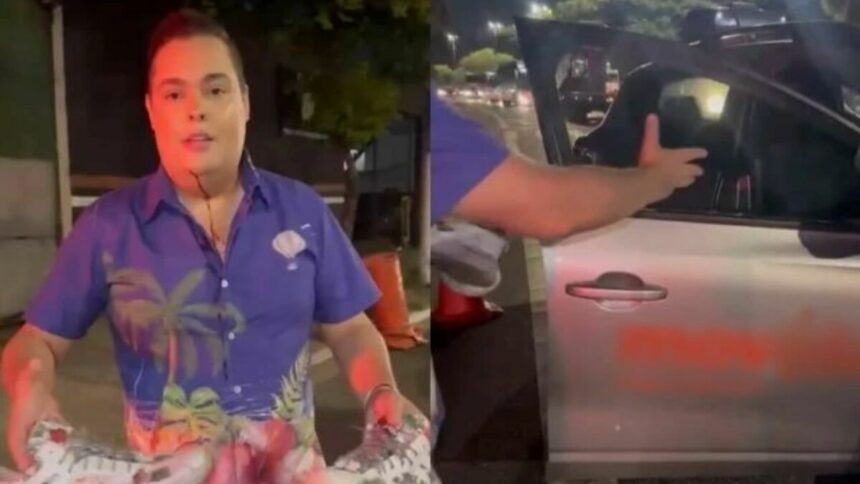 Fofoquito sangrando e mostrando o vidro do carro quebrado no assalto