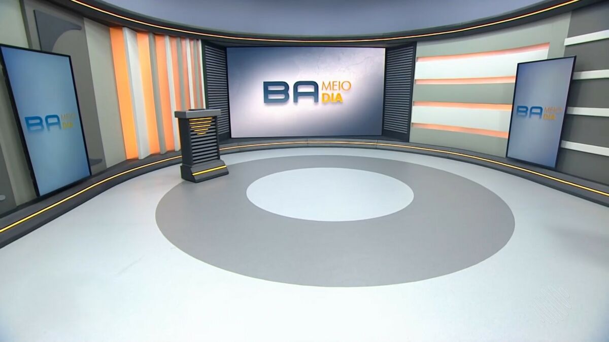Cenário do Bahia Meio Dia com um telão gigante ao fundo e um piso circular com cores brancas e cinzas na TV Bahia/Globo