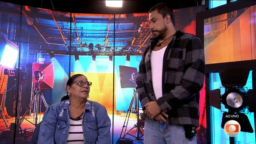 Delma olha para Maike, que está em pé, dentro do confessionário do BBB 25