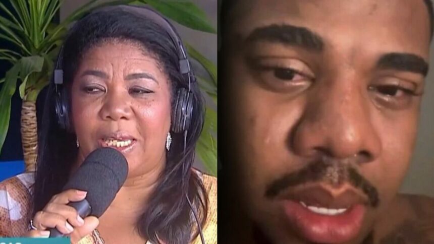 Elisangela Brito, mãe de Davi Brito, segura microfone da RECORD. Davi Brito está chorando com lágrimas nos olhos em vídeo recente