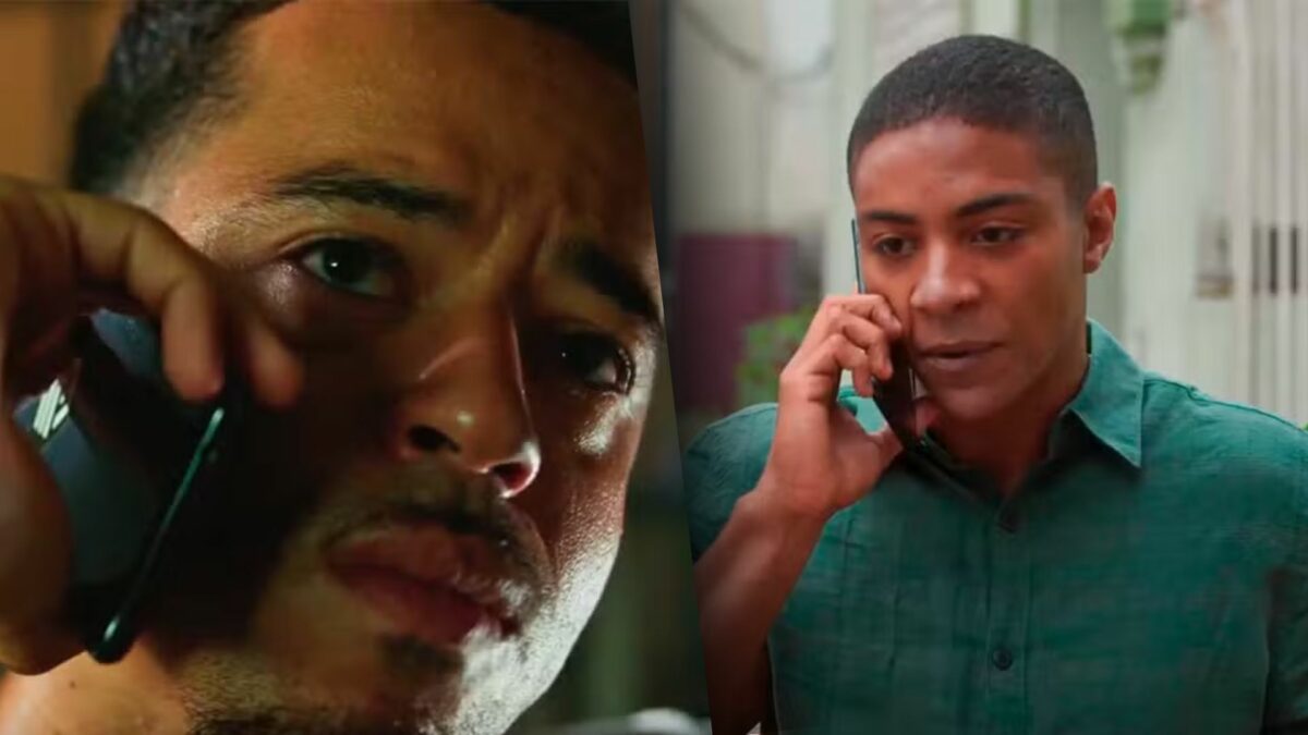 Ryan segura microfone e liga para Marlon que atende em uma rua em cena da novela Dona de Mim
