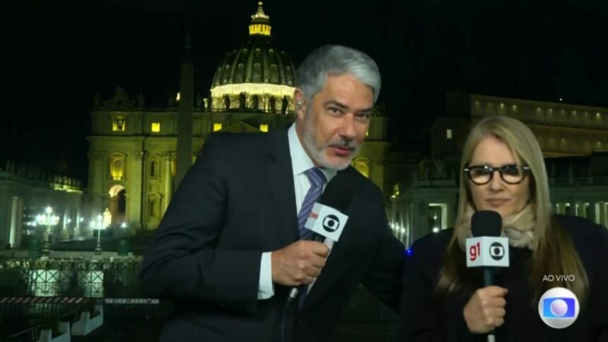 William Bonner tentando dar um abraço em Ilze Scamparini ao vivo no Jornal Nacional