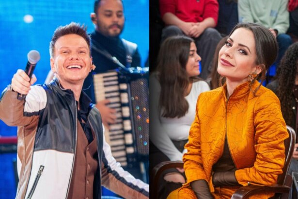Michel Teló segura microfone no palco do Altas Horas. Ao lado Sandy sentada no palco do mesmo programa. Ela veste uma roupa laranja