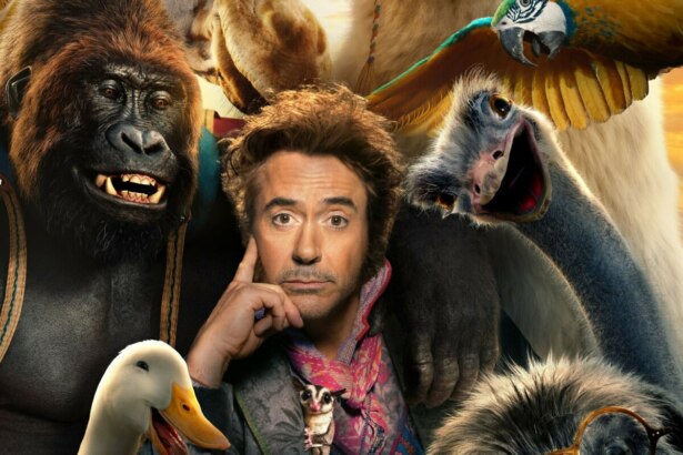 Robert Downey Jr. cercado por animais no pôster do filme Dolittle