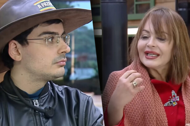 Dudu com chapéu de fazendeiro olhando para Gaby Spanic que levanta o braço rebatendo o peão na cozinha de A Fazenda 17