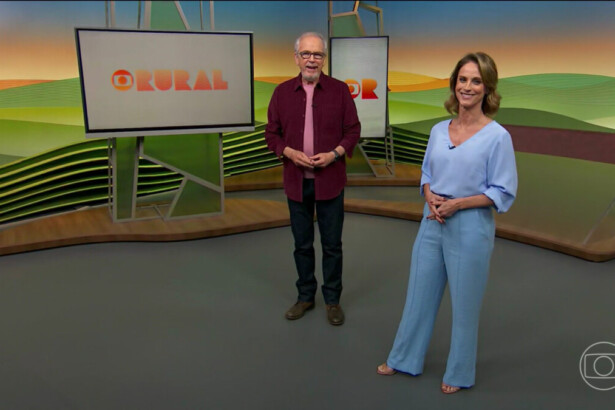 Nélson Araújo e Helen Martins caminham no cenário do Globo Rural