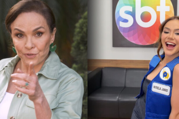 Luíza Tomé aponta o dedo para a câmera enquanto Mirela Janis sorrir no camarim do SBT. Ela veste colete azul